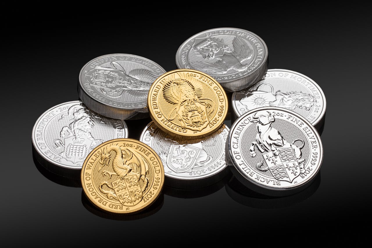 Close-up of valuable gold and silver coins showcasing intricate designs.